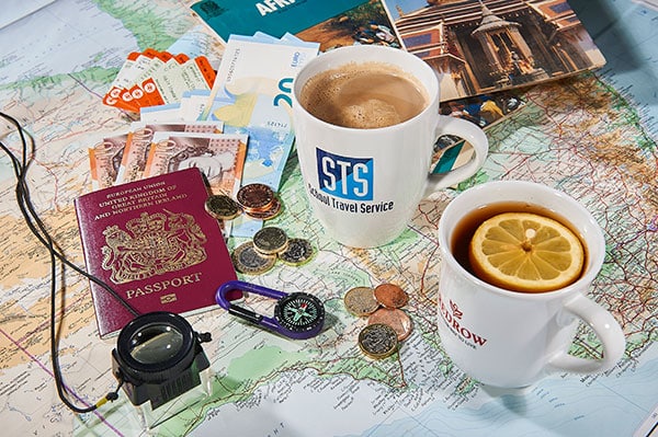 Promotional mugs on a map from Prince William Pottery