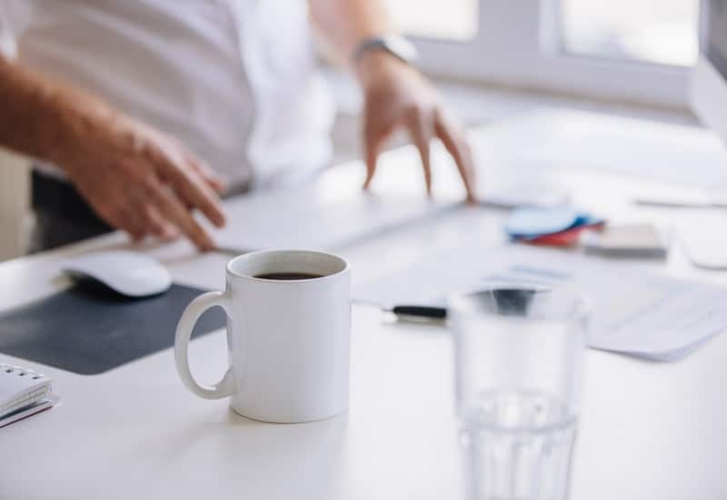 white-mug-on-a-desk-in-an-office