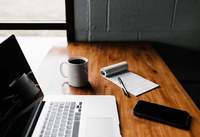 desk-with-laptop-mug-and-notepad