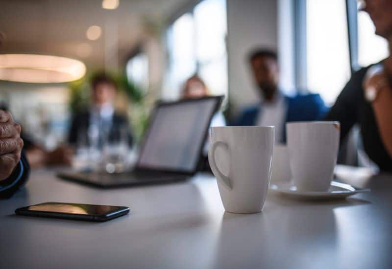 business-meeting-with-mugs-on-table