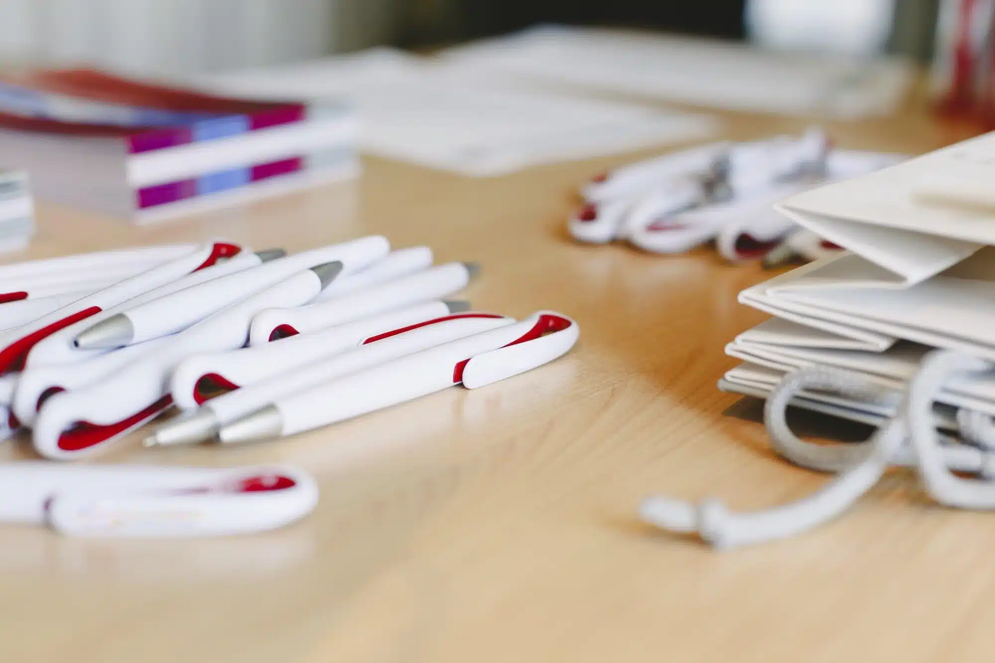 promotional pens on office desk